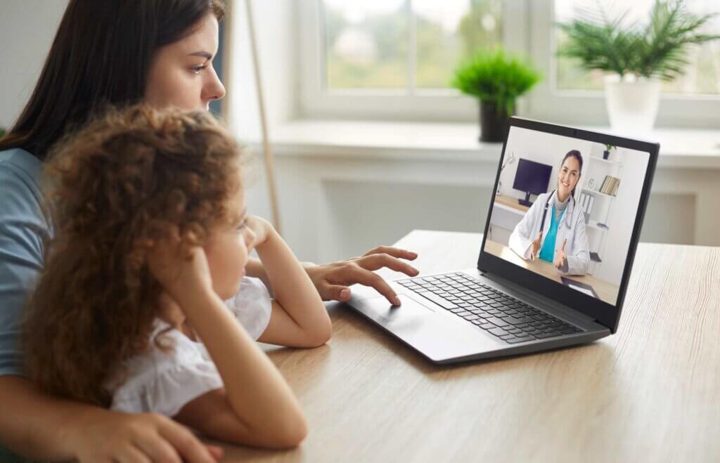 Mother and daughter having an online telemedicine consultation