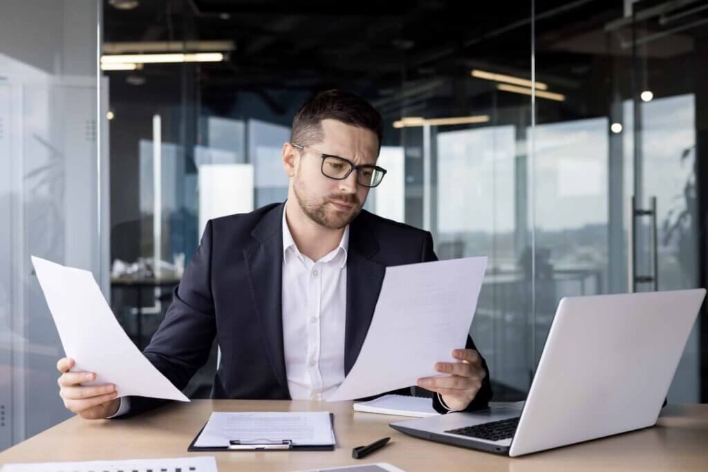 man reviewing group health plan rates