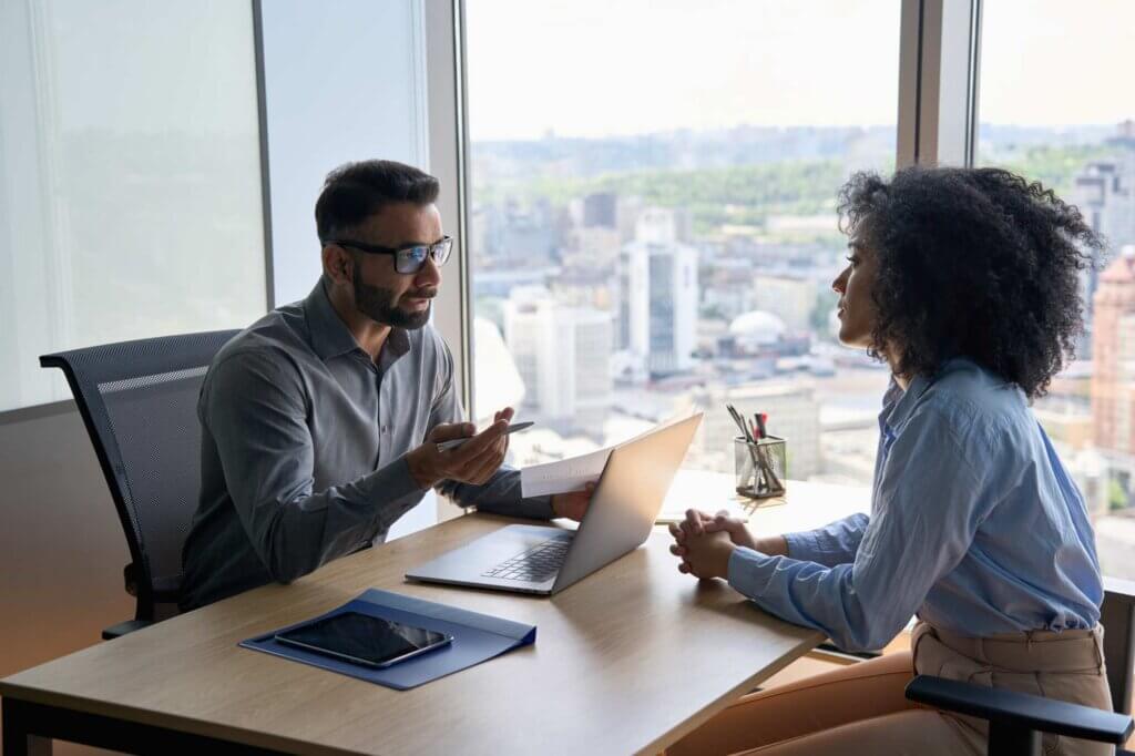Manager discussing DEI guidance details with staff member.