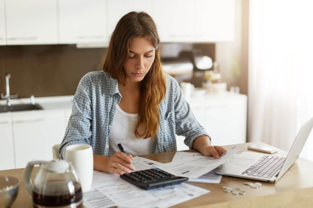 Woman calculating medical expenses.