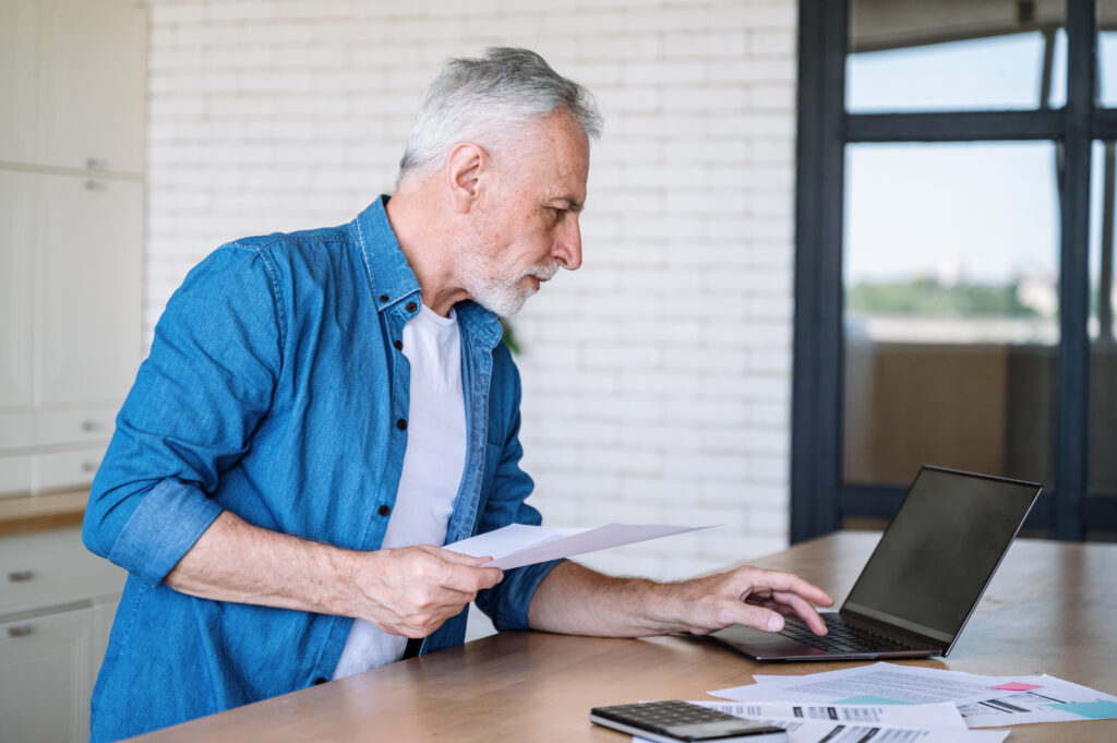 man reviewing bank statements for HSA